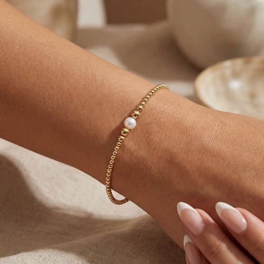 Everly Davis Jenna Pearl Beaded Bracelet, gold filled, minimalist style with one pearl accent, 2mm-4mm beads.