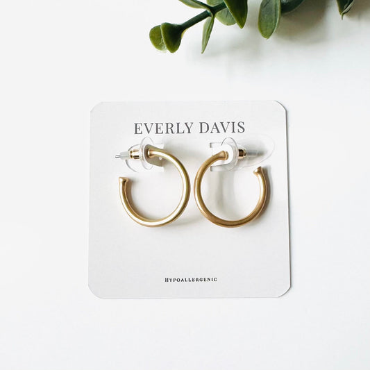 Everly Davis matte gold hoop earrings with hypoallergenic backing. Classic, minimalist design.