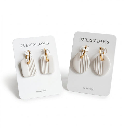 Everly Davis white clay square and oval earrings with gold huggies and vertical stripe detail.