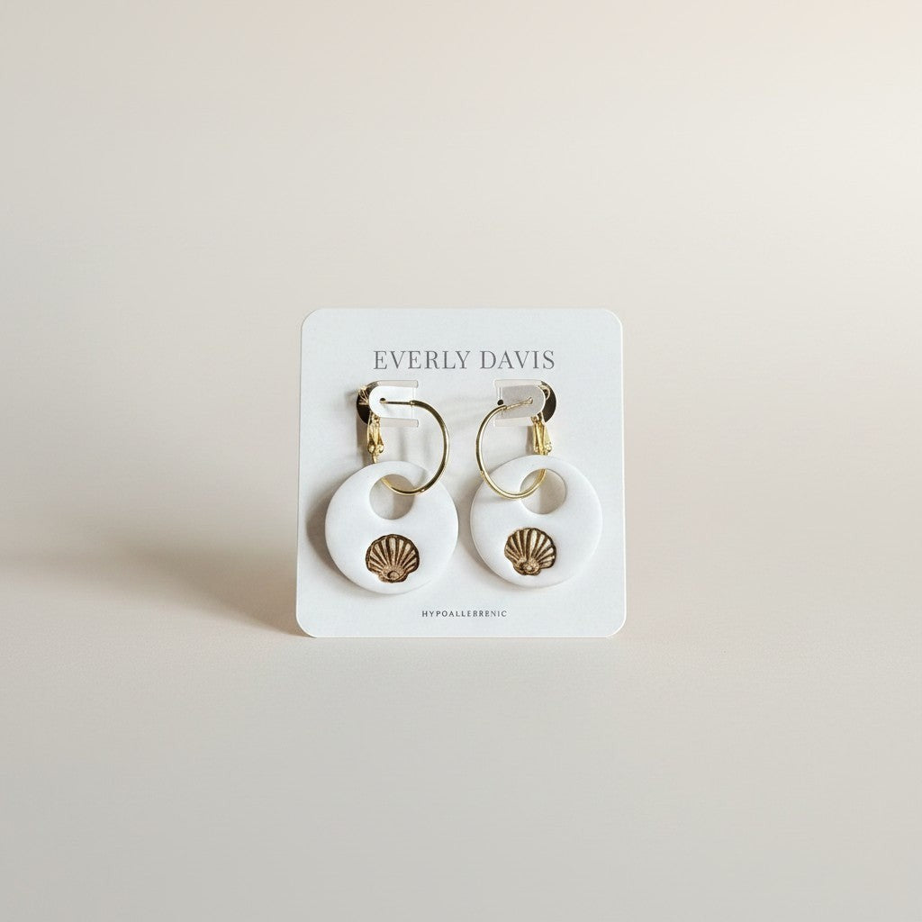 Everly Davis white polymer clay hoop earrings with gold seashell accent. Lightweight and hypoallergenic.