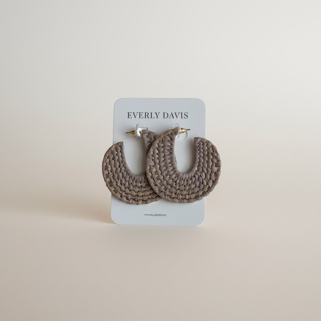 Everly Davis woven raffia hoop earrings with metal disk base, 2-inch length, taupe and natural tones, boho style.