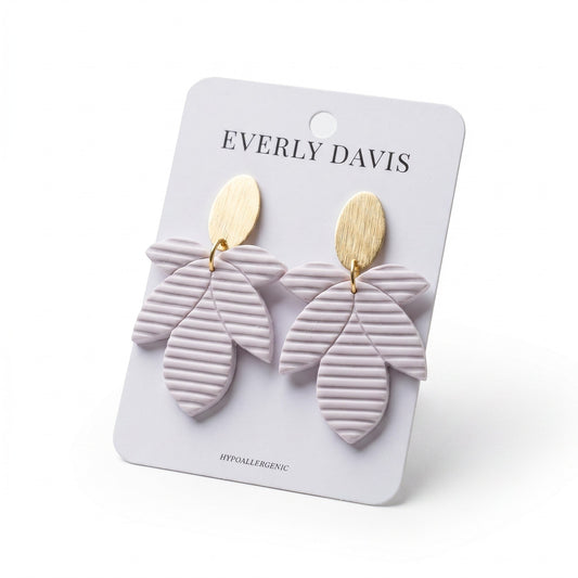 Everly Davis Amie earrings, light purple clay with ribbed texture and gold oval studs. Hypoallergenic.