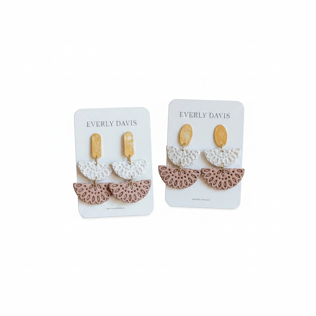 Everly Davis Annie earrings in white and dusty rose with gold accents. Dangle earrings with intricate cut-out fan shapes.