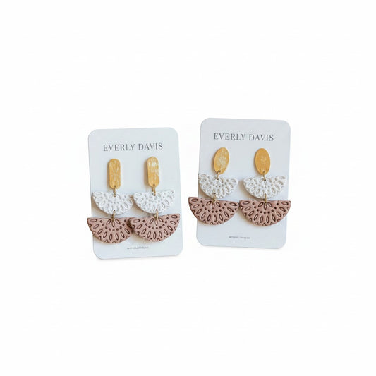 Everly Davis Annie earrings in white and dusty rose with gold accents. Dangle earrings with intricate cut-out fan shapes.