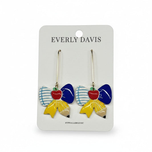 Everly Davis back-to-school themed dangle earrings featuring blue and white striped bows, yellow pencils, and red apples.