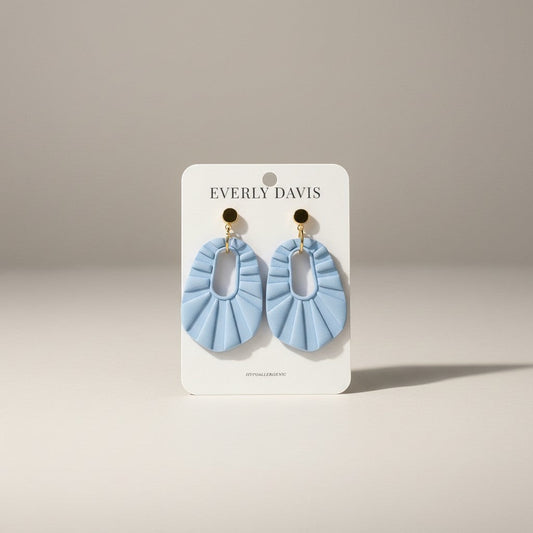Everly Davis light blue pleated oval clay earrings with gold posts. Hypoallergenic.