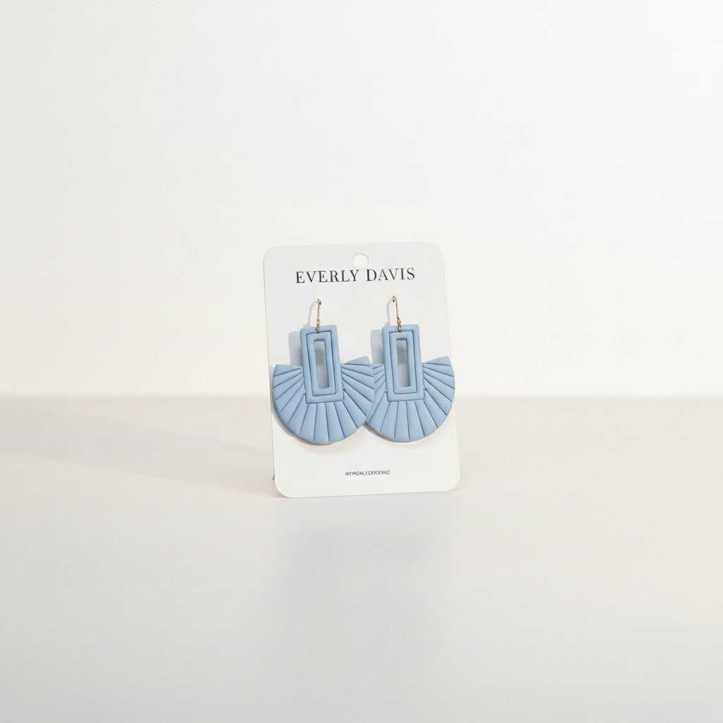 Everly Davis light blue handcrafted clay fan earrings with rectangular cutout detail.