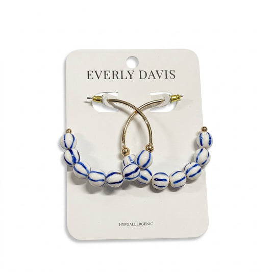 Everly Davis blue and white striped ball hoop earrings with gold accents. Hypoallergenic post back.