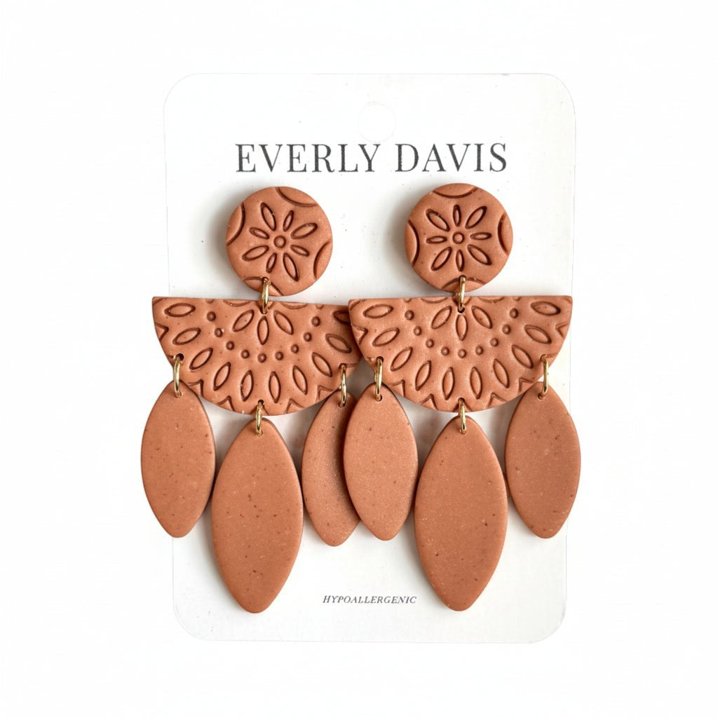 Everly Davis terracotta polymer clay boho dangle earrings with embossed patterns and teardrop shapes.