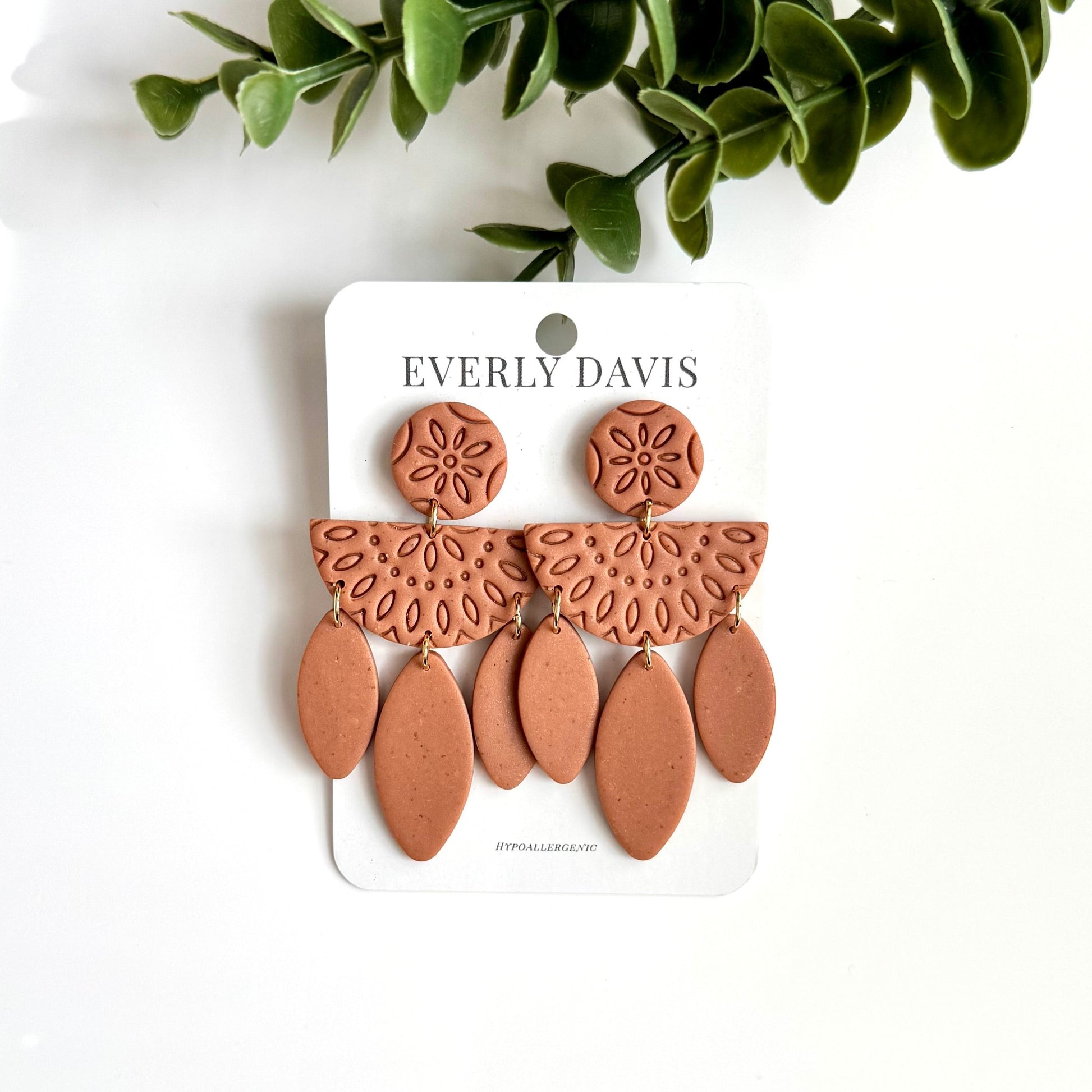 Everly Davis terracotta polymer clay boho dangle earrings with embossed circular studs and semi-circular top.