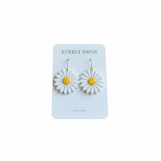 Everly Davis white daisy flower earrings with yellow centers, handcrafted from lightweight clay. Hypoallergenic and nickel-free.