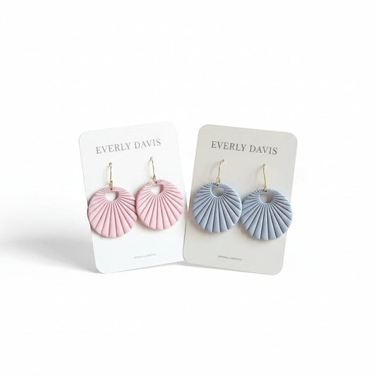 Everly Davis fan shaped statement earrings in pastel pink and baby blue, made from polymer clay with gold-plated hooks.