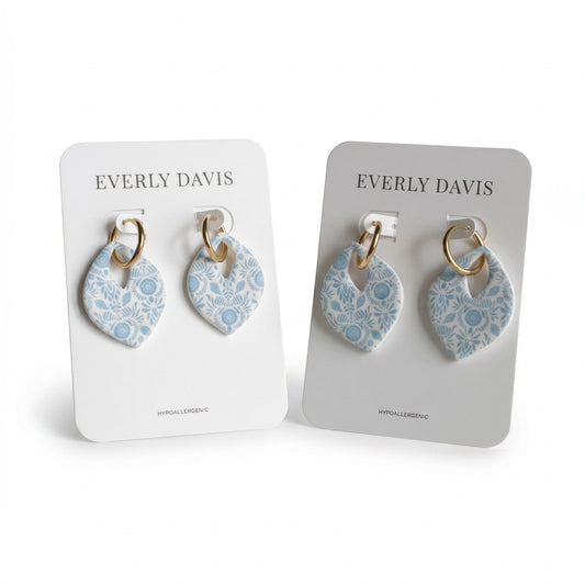 Everly Davis blue and white floral drop earrings with gold hoops. Hypoallergenic and water-resistant.