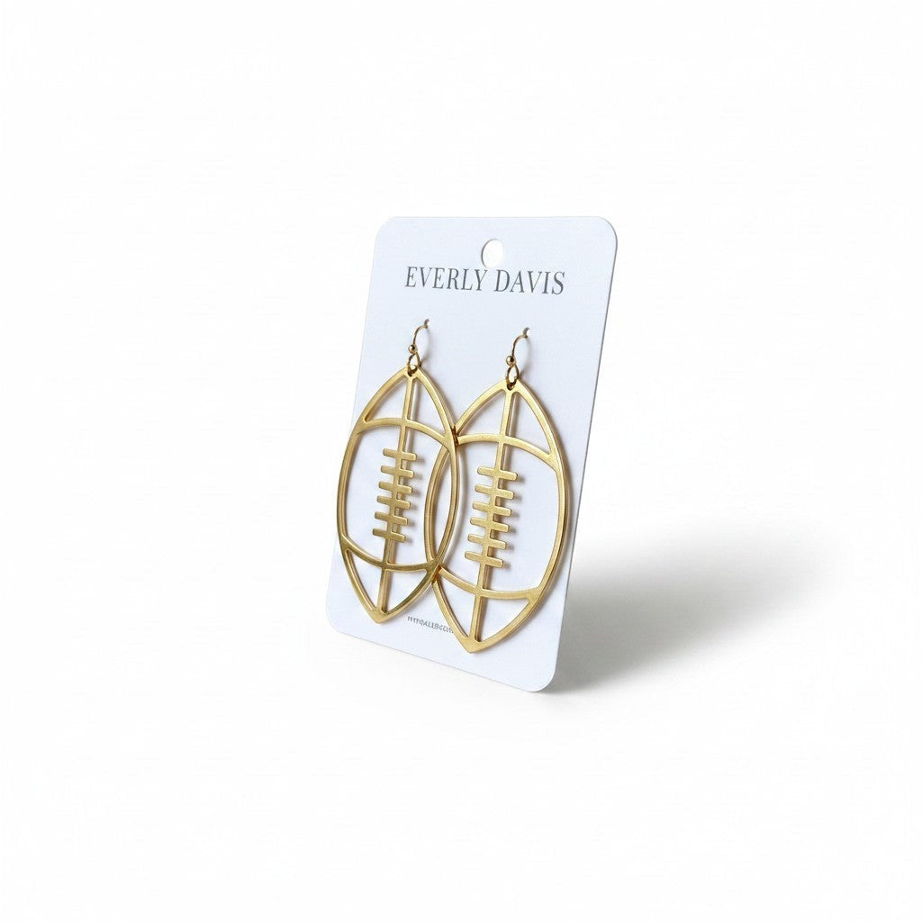 Everly Davis gold football open dangle earrings with fish hook closure. Sporty statement jewelry.