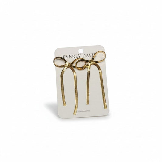 Everly Davis gold stainless steel long tail bow drop earrings with chain detail.