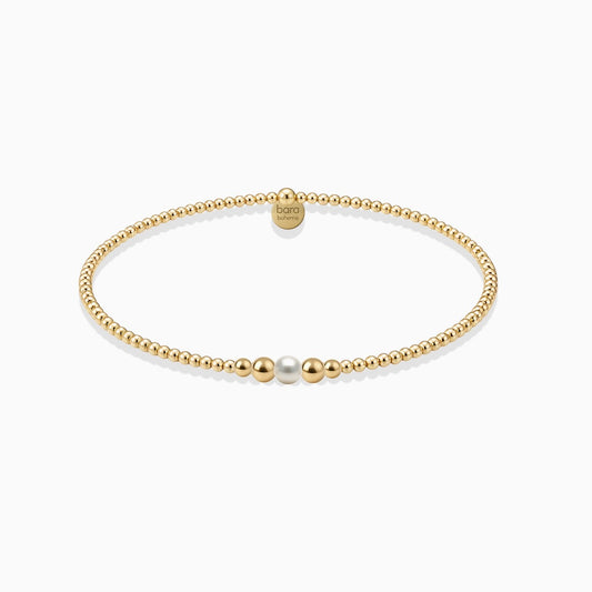 Everly Davis Jenna Pearl Beaded Bracelet, gold filled, minimalist, stackable, stretch cord, 2mm-4mm beads, single pearl accent.