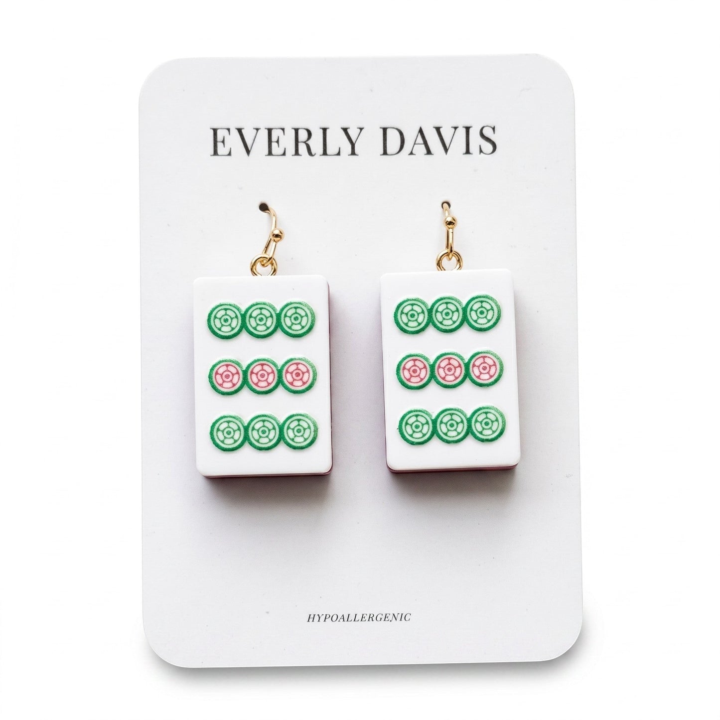 Everly Davis white acrylic drop earrings with green and pink Mahjong tile design. Hypoallergenic gold-tone hooks.