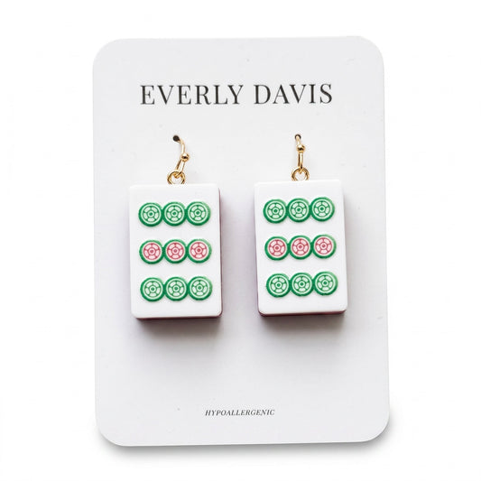 Everly Davis white acrylic drop earrings with green and pink Mahjong tile design. Hypoallergenic gold-tone hooks.