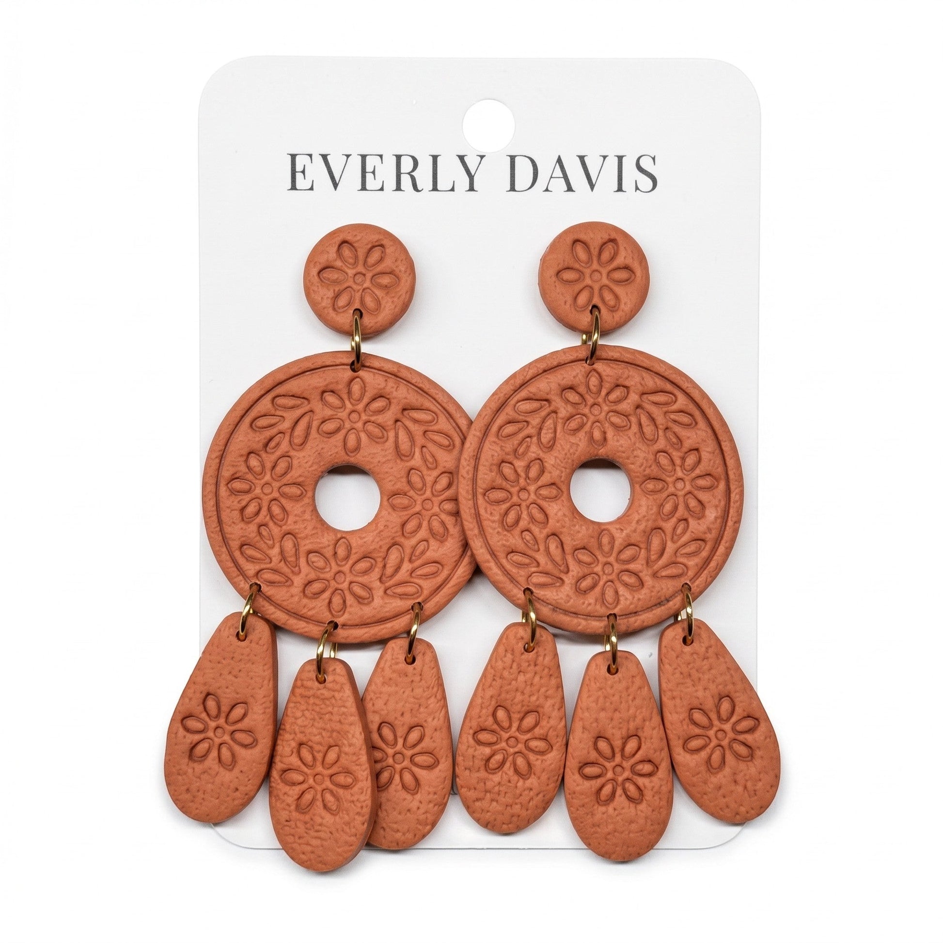 Everly Davis Mitzie Dangles terracotta clay earrings with floral cutouts and teardrop charms.