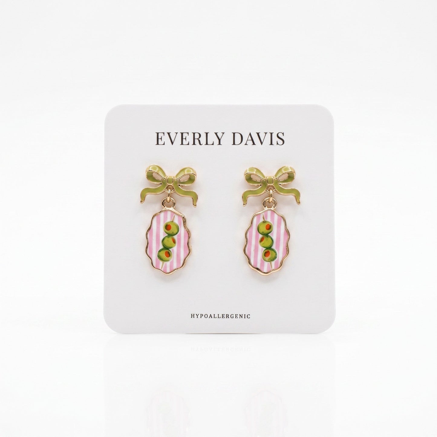 Everly Davis gold-tone earrings with green bows and oval pendants featuring pink stripes and green olives.