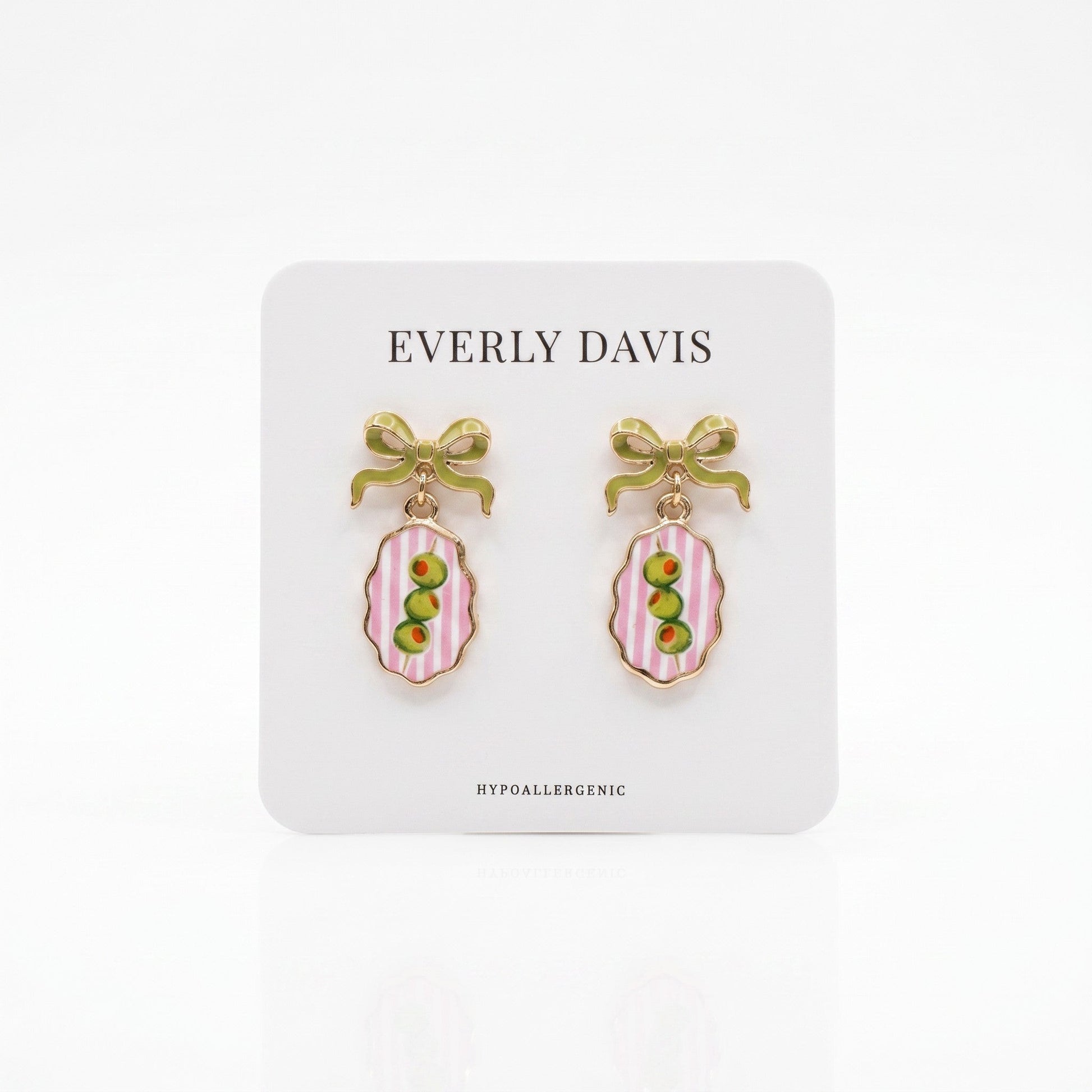 Everly Davis gold-tone earrings with green bows and oval pendants featuring pink stripes and green olives.