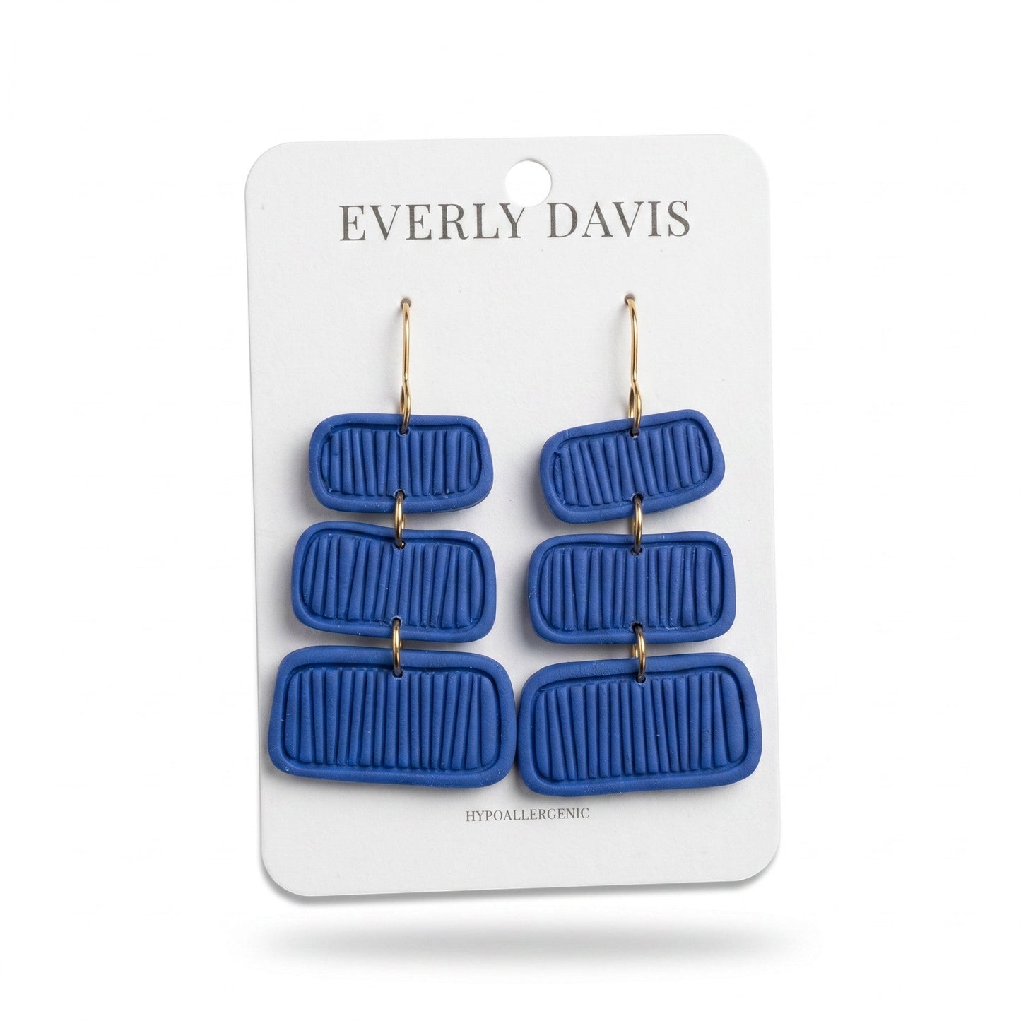 Everly Davis Pammi blue clay dangle earrings with a ribbed texture and gold hooks. Hypoallergenic.