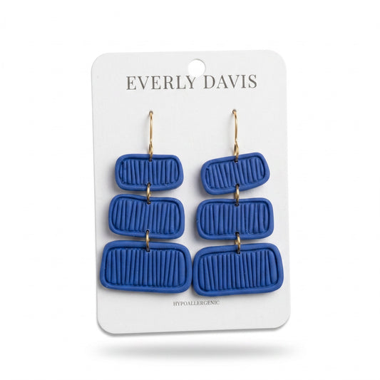 Everly Davis Pammi blue clay dangle earrings with a ribbed texture and gold hooks. Hypoallergenic.