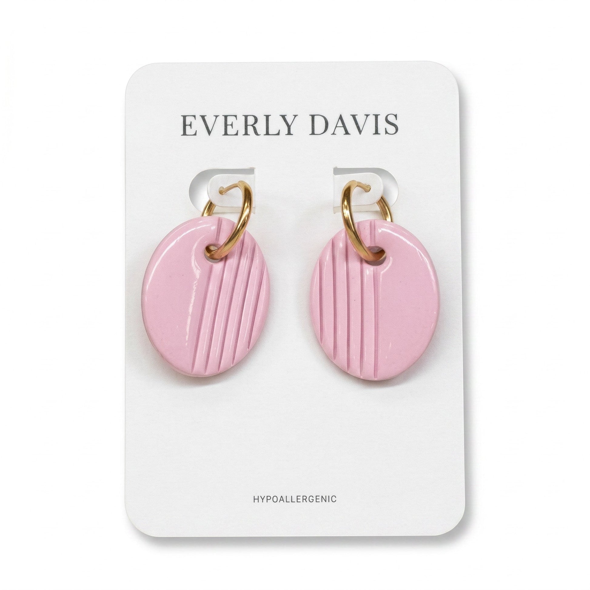 Everly Davis oval pink clay earrings with gold huggie hoops and vertical stripe texture. Hypoallergenic.