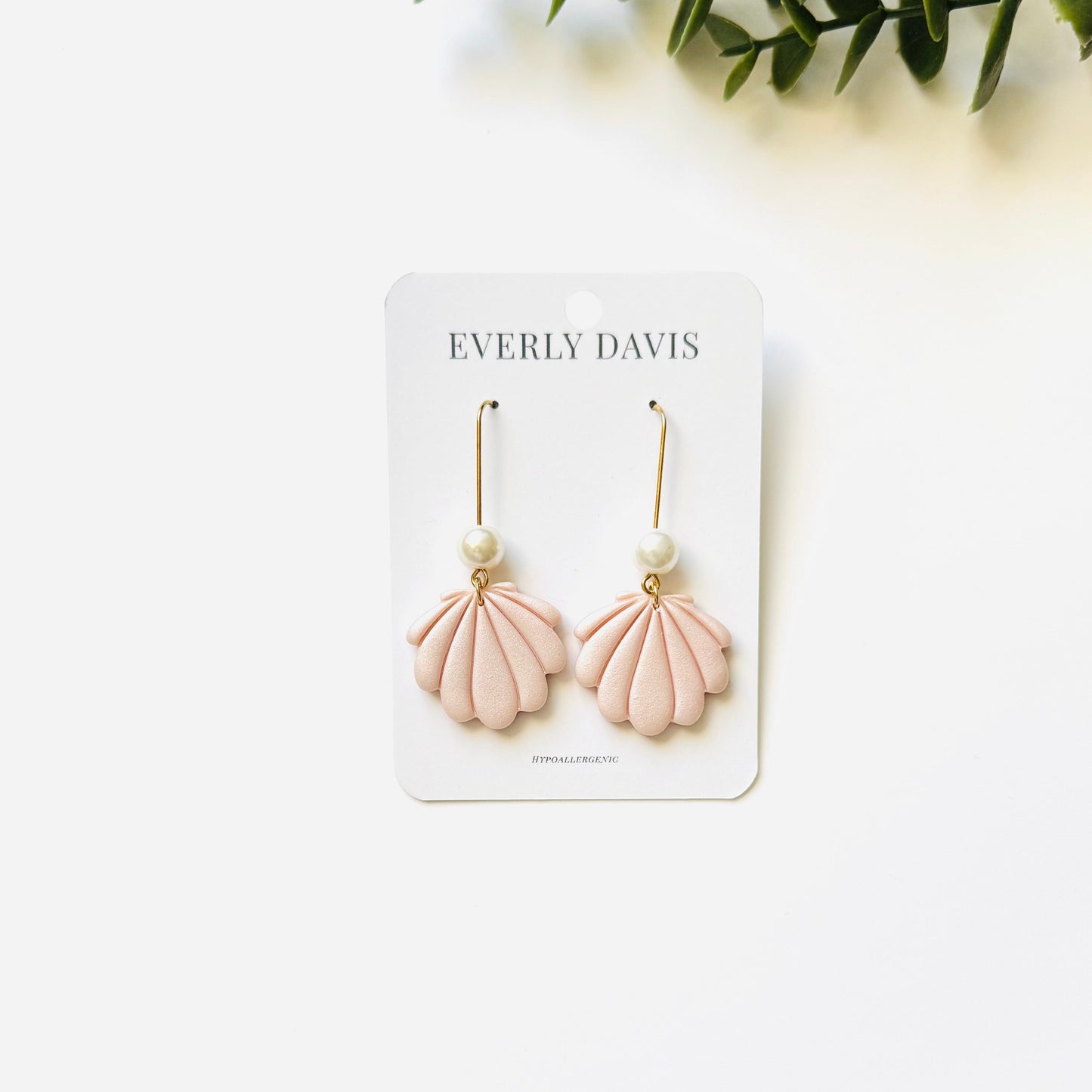 Everly Davis pink shell clay earrings with pearl accents. Hypoallergenic and lightweight for a beachy vibe.