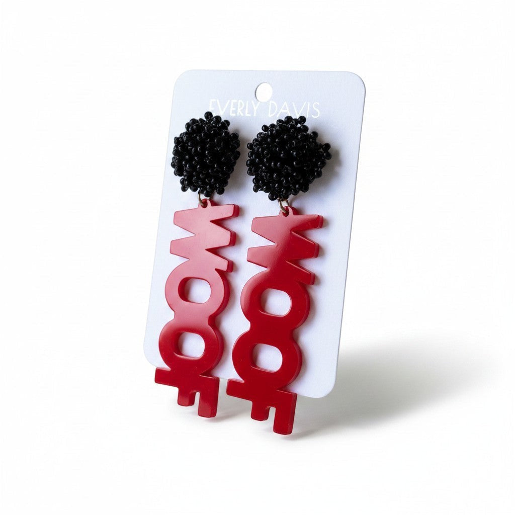 Everly Davis red acrylic WOOF letter earrings with black beaded tops.