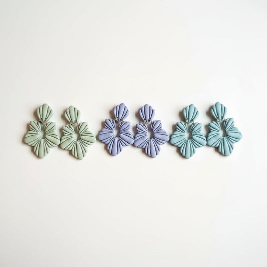 Everly Davis sculptural floral statement earrings in dusty rose, lavender, and sage green polymer clay.