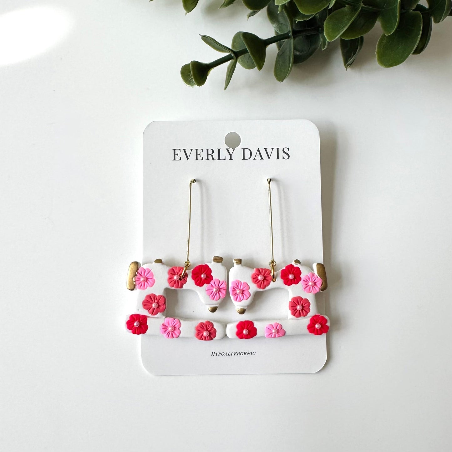 Everly Davis white sewing machine dangle earrings with pink and red floral accents, hypoallergenic.