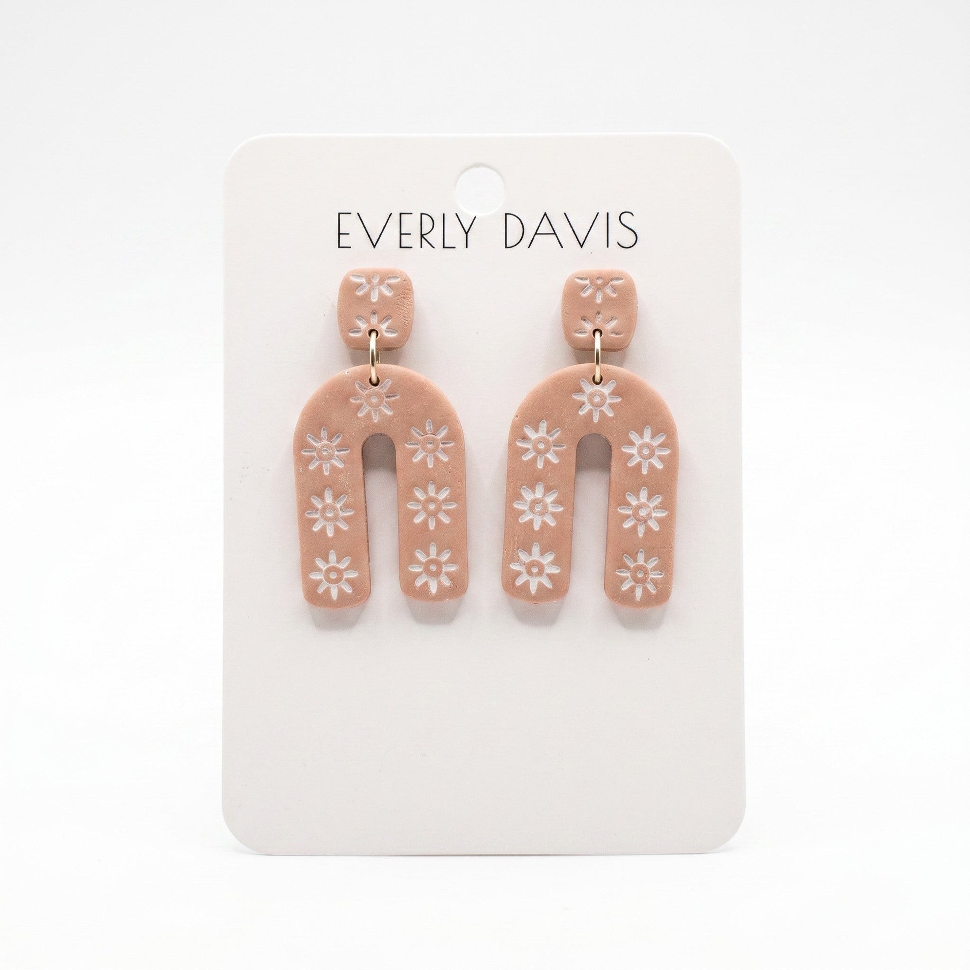 Everly Davis Sophia earrings: terracotta clay with white floral pattern, geometric arch shape, lightweight statement earrings.