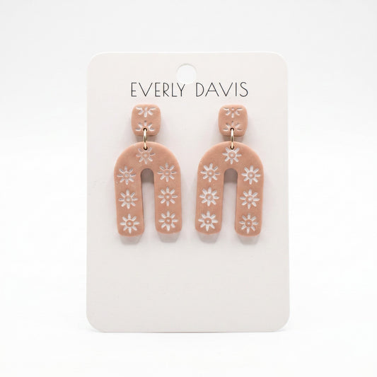 Everly Davis Sophia earrings: terracotta clay with white floral pattern, geometric arch shape, lightweight statement earrings.