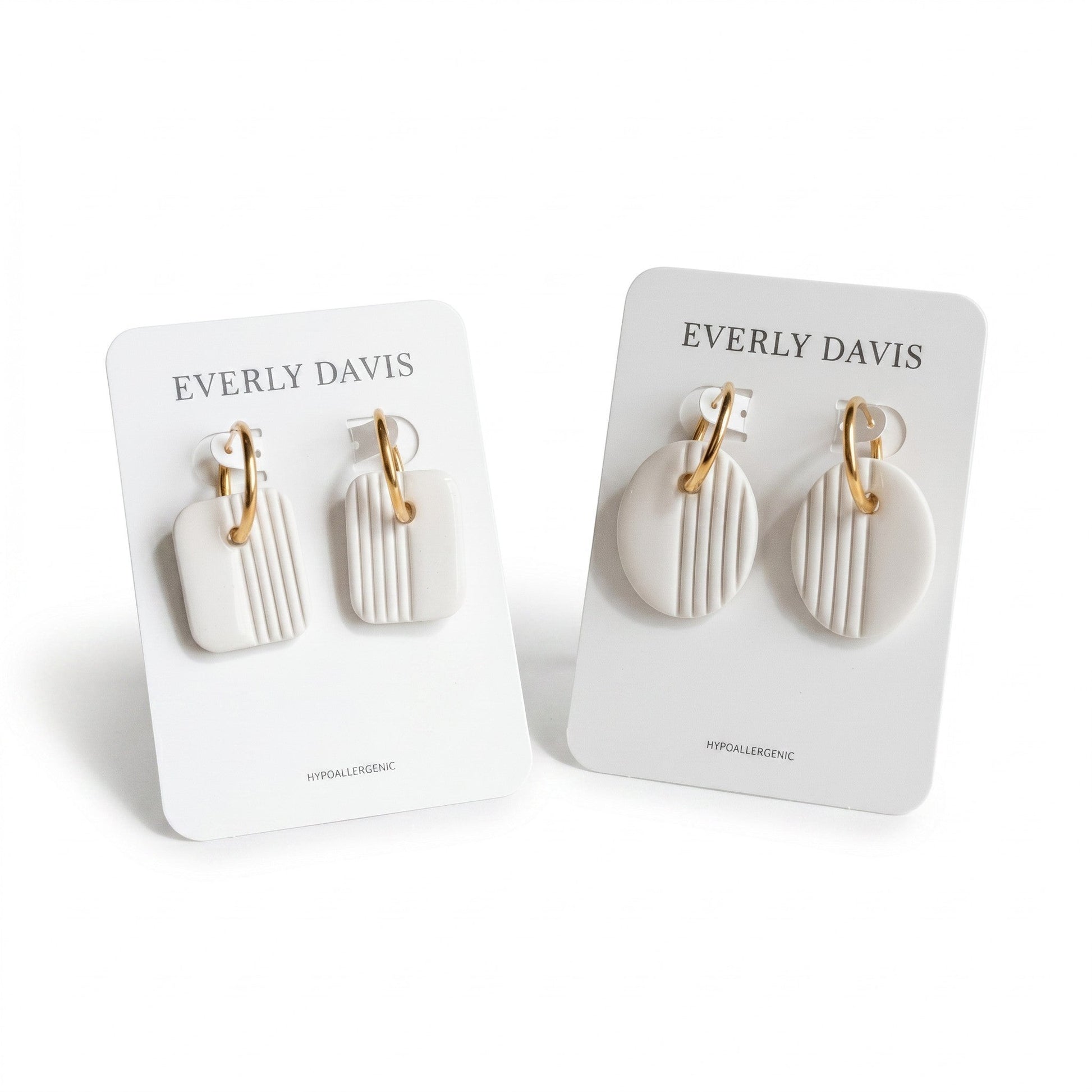 Everly Davis white clay square and oval earrings with gold huggies and vertical stripe detail.