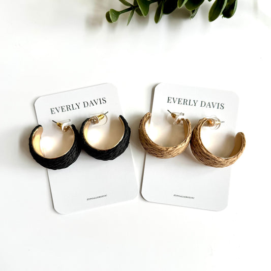 Everly Davis woven hoop earrings in black and natural straw with gold-tone accents. Hypoallergenic.